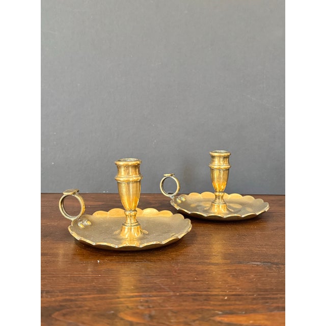 Beautiful and unique pair of scalloped chamber-sticks. Hand carried home from England.