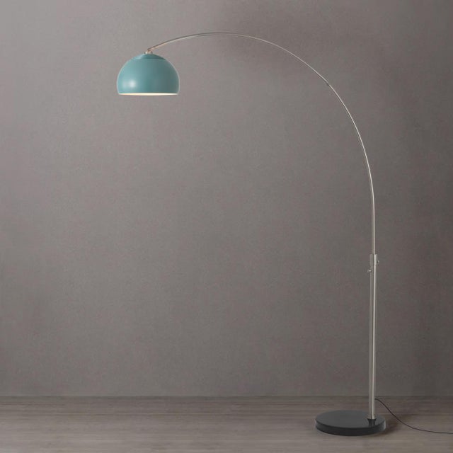 The Half Dome Arc Lamp is a modern arc lamp designed by Peter Morelli in 1960, featuring a sleek satin nickel steel body...