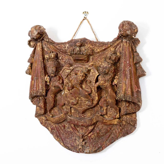 This captivating early 20th Century plaster Dutch Republic heraldic plaque boasts a regal ensemble of crowned lions, a...