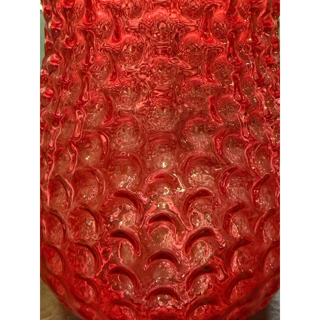 Stunning vintage Fenton glass vase featuring a gorgeous, vibrant ruby red color and intricate raised hobnail pattern....