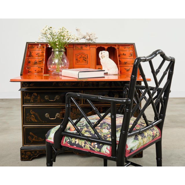 Dramatic English George III style slant drop front secretary chest featuring a lacquered case decorated in the chinoiserie...