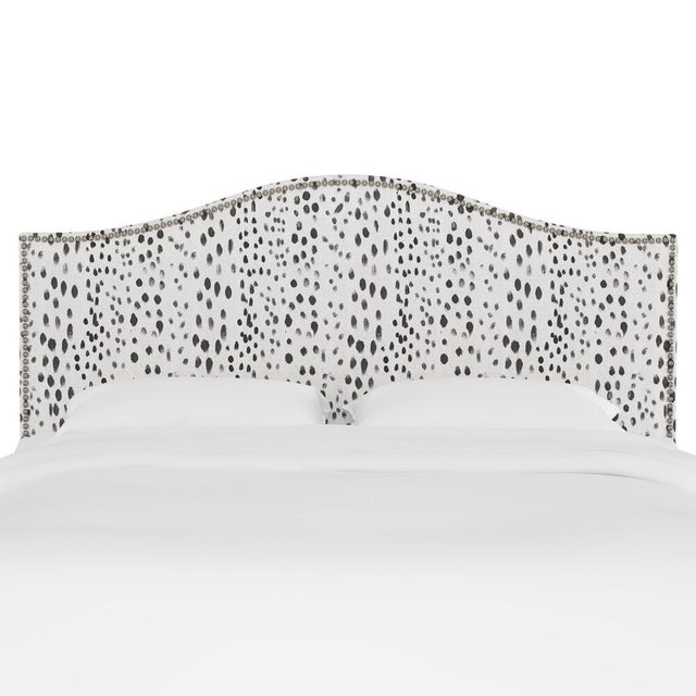 Give your interior a lift with the Headboard. Featuring the delicate curves of a classic camelback design, with subtle...