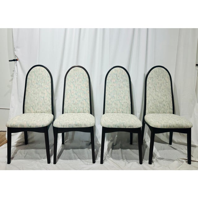 A striking set of four high-back dining chairs designed by Benny Linden. Renowned for minimalist Scandinavian elegance and...