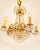 Very beautiful and richly executed vintage chandelier from the 1960s/70s, crafted in brass and fully fitted with cut prism...