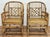 Vintage pair of Brighton Pavilion Chippendale style burnt rattan arm chairs with caned seats. Feature solid fretwork...