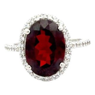 Elegant Oval Garnet Halo Ring With Cubic Zirconia Accents in 925 Silver - Size 7 For Sale