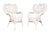 A pair of Heywood Wakefield wicker woven rattan armchairs circa 1920. Sculptural backs of woven wicker are pierced with...