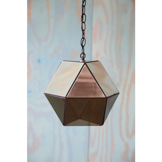 Custom made hexagonal mirrored glass and smoked lucite pendant lamp with 15’ of chain. Smoked lucite bottom allows light...