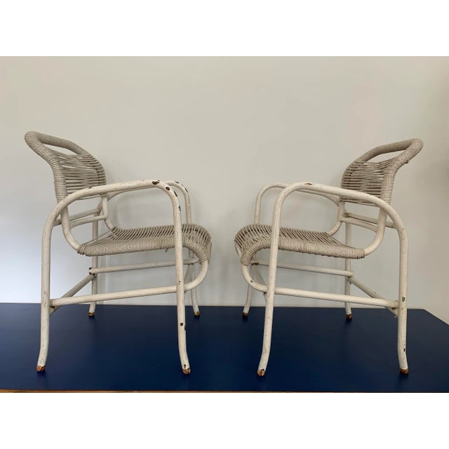 A solid pair of iron French garden chairs with nylon rope seat and back. Leave as is for that perfect lived-in look (like...