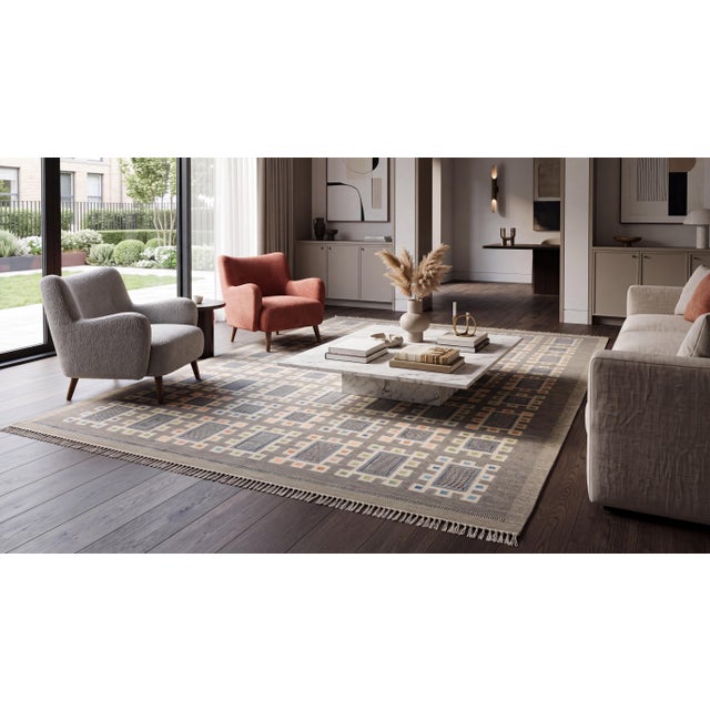 Elevate your interior with this exceptional contemporary hand-Knotted wool flatweave rug, masterfully crafted in the...