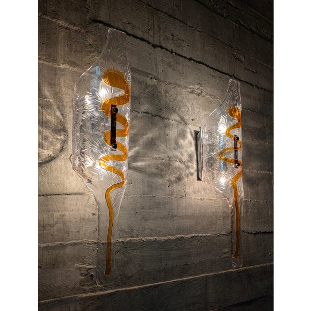 Pair of large-format Italian wall sconces from the 1970s, attributed to Toni Zuccheri for Mazzega. Constructed from...