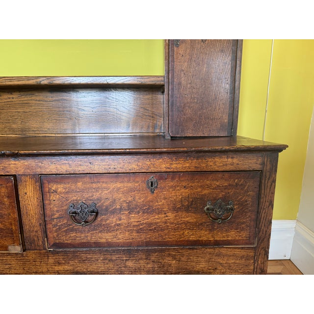 This Welsh Dresser or Welsh Cupboard has the beautiful patina of age and has lived an active and elegant life. It is...