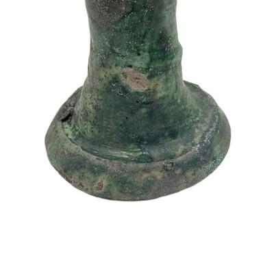 A Moroccan Tamegroute glazed candlestick holder is a handcrafted piece made in the historic pottery village of Tamegroute...