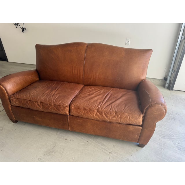 Beautiful leather sofa from Mitchell Gold for Restoration Hardware early 1990s. Has serverd our family well and aged with...