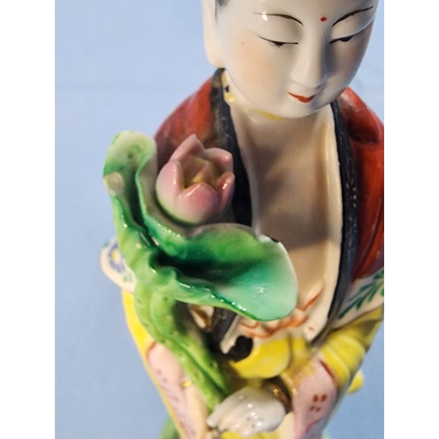 Vintage Quan Yin Chinese Fine Porcelain Hand Painted Sculpture. Representing Divinity. Quan Yin is holding a Lotus Flower....