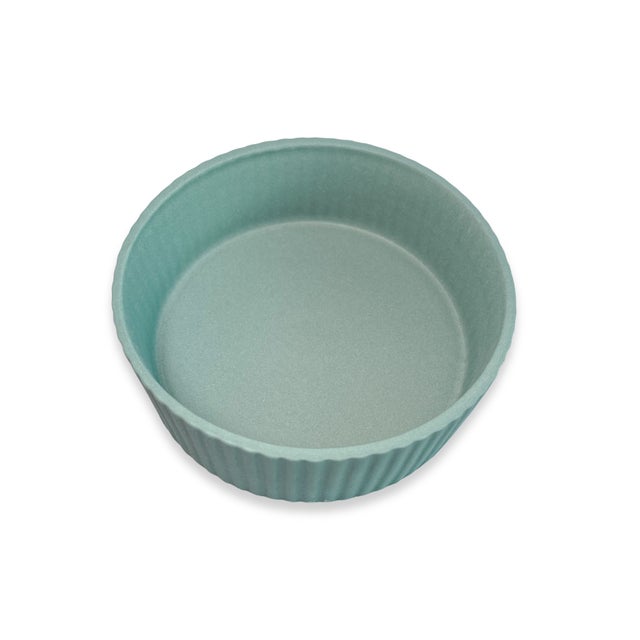 A classic vintage Wedgwood jasperware trinket box in a soft green hue, featuring a finely detailed neoclassical relief...