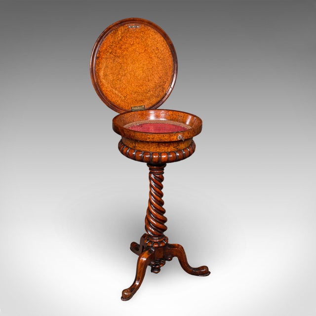 This is an antique spirits table. An English, burr maple and walnut decanter & glasses stand or teapoy, dating to the...