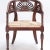 A Pair of Italian walnut open arm chairs with cord seats and cut out design. Circa 1800.