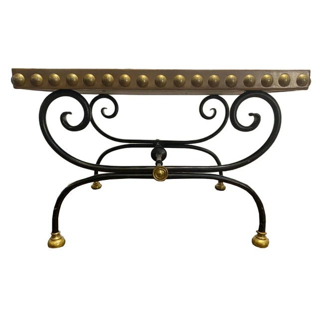 An exquisite piece that embodies the epitome of French elegance and craftsmanship - a French Maison Jansen style table....