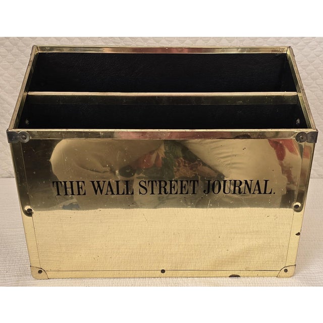 Mid-20th century brass magazine or newspaper holder prominently marked “The Wall Street Journal” on the front panel....