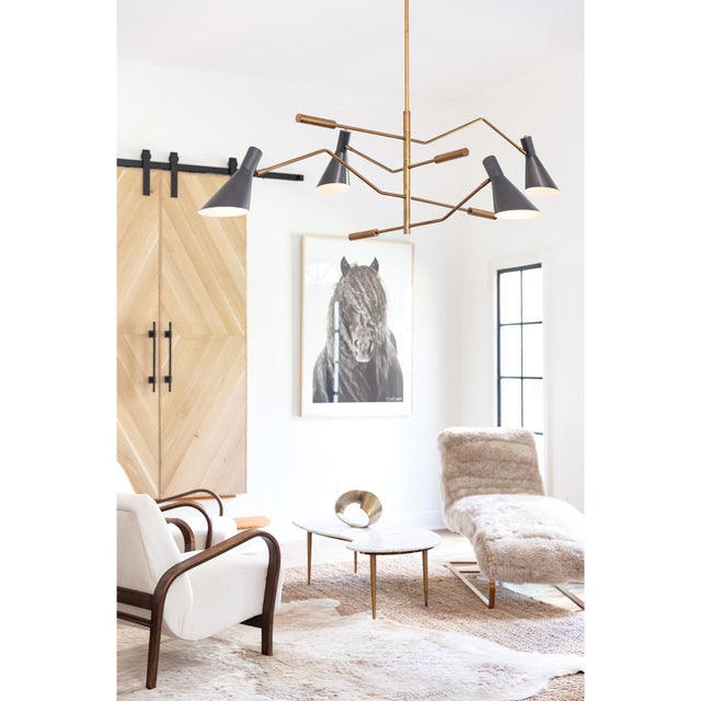 Add a modern statement with this unique, adjustable chandelier. Spyder's adjustable arms are each subtly unique in shape,...
