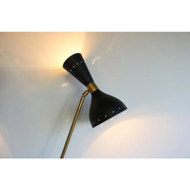 Stunning Italian design floor lamp 1950s Stilnovo style. Wonderful minimalistic shape. The floor lamp has six-light...