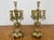 An impressive pair of Vintage brass candelabras featuring elegant five-arm candle holders with richly ornate decorative...