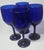 Four gorgeous fluid ocean blue goblets ready for a day at the beach- or your table.