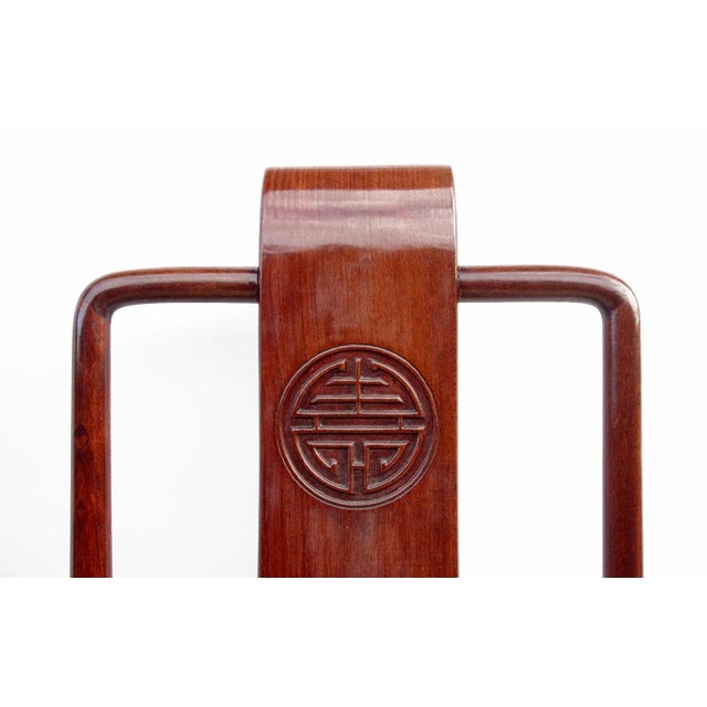 This pair of Chinese Ming dynasty style chairs stand on four square section legs. The square features rounded corners with...