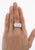 Vintage Art Deco three-stone natural diamond engagement ring. Set in platinum with a hand-carved filigree on the shank....