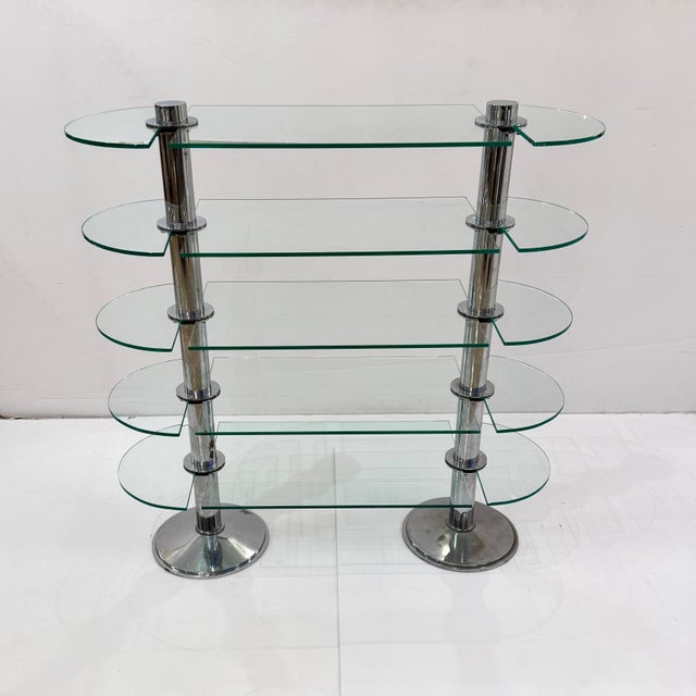 An Art Deco period etagere by Siegel of Paris from France circa 1930. These display shelves feature a pair of steel...