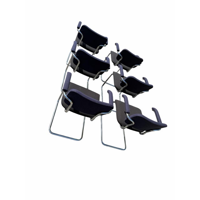 Extremely hefty and well crafted, each armchair is stamped to the chrome under-arm with Knoll insignia. Seats are...