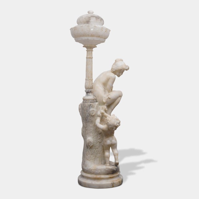 Early 20th Century Pair of Monumental Antique Italian Carved Alabaster Venus & Cupid Figural Torchiere Lamps on Black Marble Pedestals For Sale - Image 5 of 12