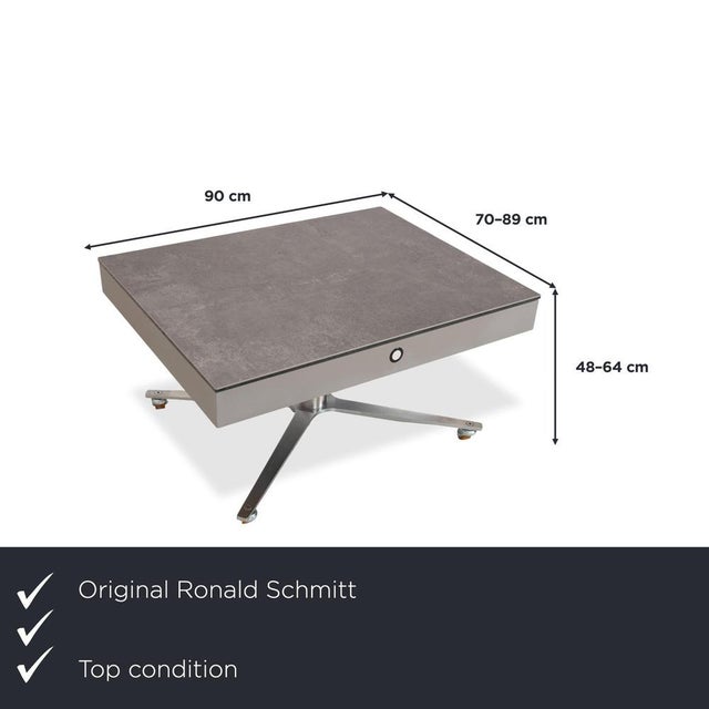 Introducing the Ronald Schmitt Glass Grey Coffee Table with Manual Function, Storage Compartment, and Plastic Finish. I...