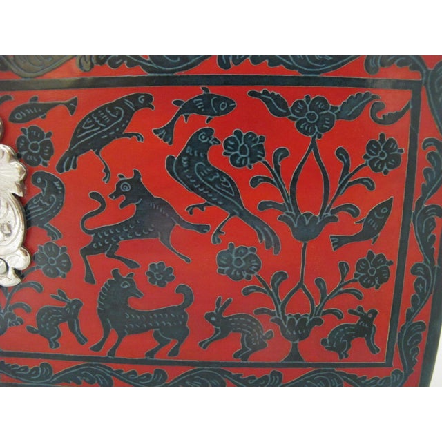 Large Mexican Olinalá folk art lacquered wood box. Typical of Olinalá lacquerware, this piece is crafted from linaloe...