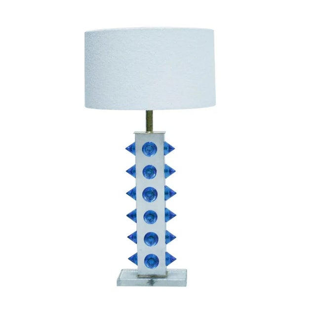 Pair of table lamps, made of metal and brass with glass feet and applications in blue Murano glass. Lampshade in bouclé...