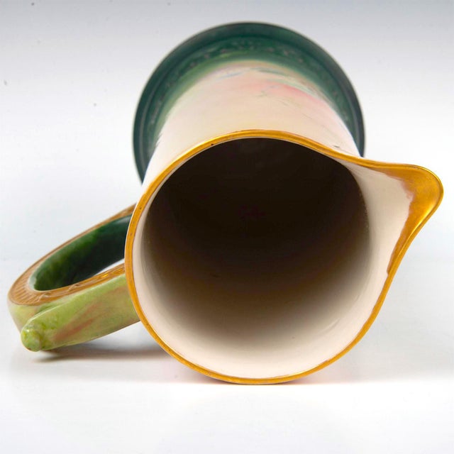 Experience the beauty and elegance of this early 20th-century North American white porcelain tankard from Belleek. This...