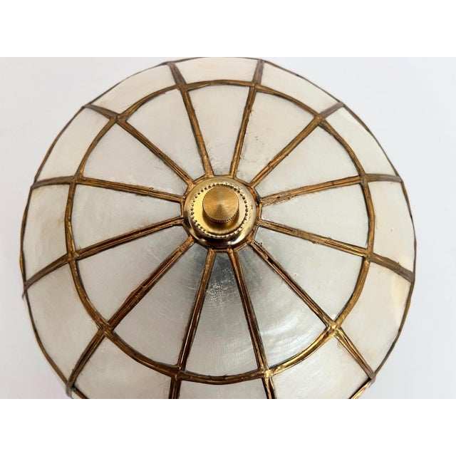 Chic petite round Capiz shell flush mount ceiling or wall light imported from the Philippines in the 1960s with brass...