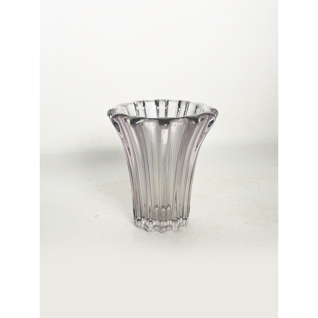 Crystal vase, France, 1970s, with an elegant and timeless design. This piece is distinguished by its flared, corolla-like...