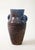 A ceramic jug with handles in a stunning glaze of aubergine and blue produced by Accolay Pottery. Founded in the 1950s in...