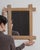 This mirror frame carries genuine presence, its natural bleached oak, chunky cross joinery immediately setting the tone...