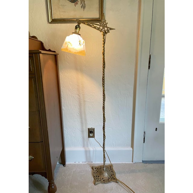 Beautiful art deco lamp and hand painted shade with a mountain scene. When the light is on, it looks like the sun shining...