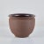 A hand thrown stoneware bowl planter from California ceramicist Robert Maxwell. The planter has a rounded lip and speckled...