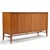 Beautiful mahogany credenza by Paul McCobb for Calvin. Two sets of tri-fold doors conceal two adjustable shelves and a...