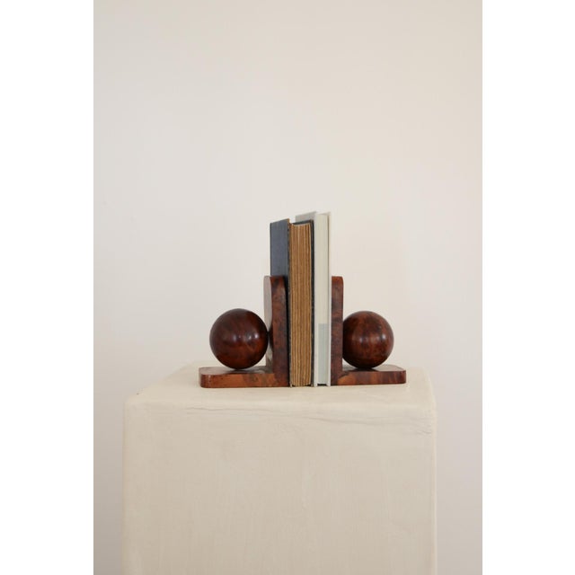 Beautiful art deco walnut burl wood round bookends. They will add a warm mid century modern feel to your bookshelf.