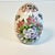 This is a lovely hand-painted ceramic Egg. We love the light pink cabana stripes on the ground. The design is a floral...