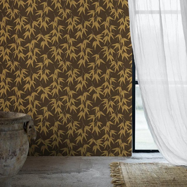 Bamboo Garden in brown-and-gold imbues interiors with a sense of earthy elegance and tranquil serenity. Boråstapeter,...