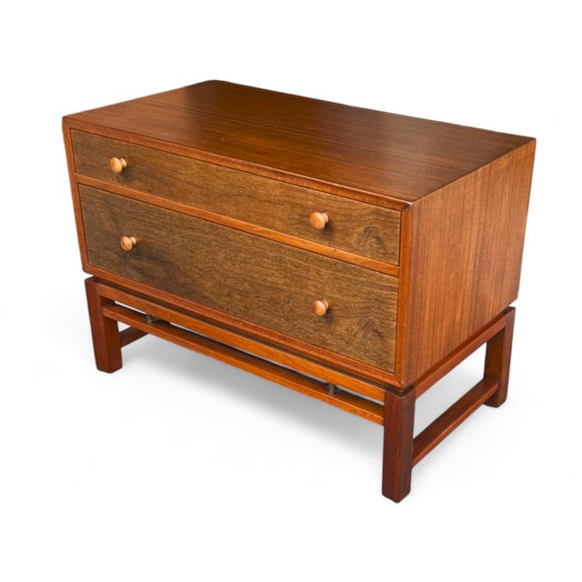 Add a touch of refined mid-century elegance to your space with this beautifully restored bedside table by Dunbar Furniture...