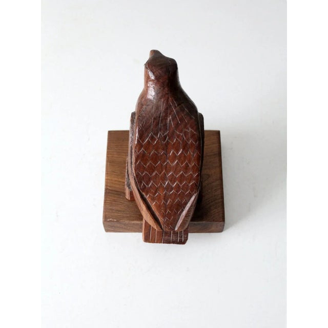 A vintage hand-carved wood American eagle with a striking sculptural presence. The finely etched detailing brings...