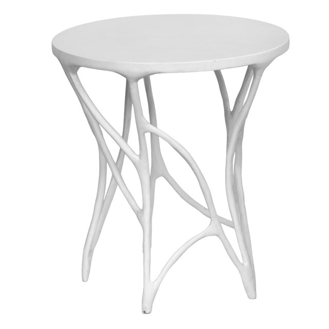 This unique piece is a Vintage Aldrich Side Table by Made Goods. It features an artfully asymmetrical "faux bois" (fake...